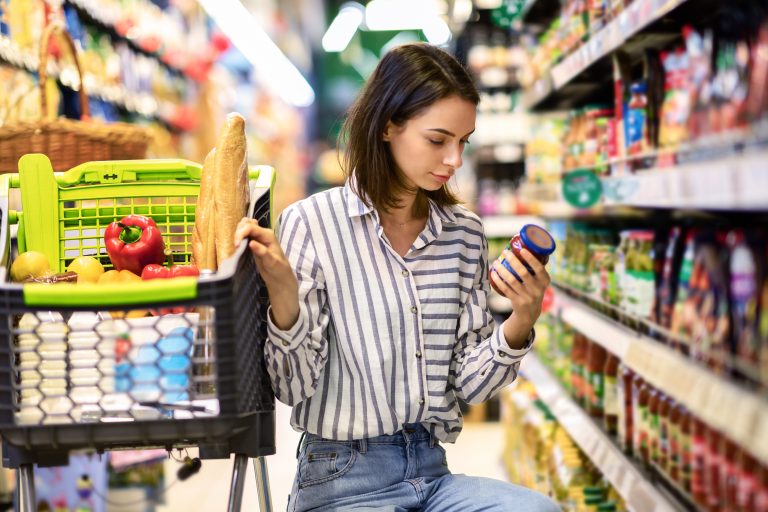 Consumption,And,Consumerism.,Portrait,Of,Young,Woman,With,Shopping,Cart