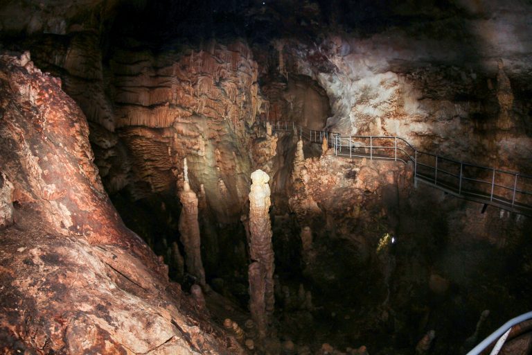 Large,Stalagmites,In,The,Depths,Of,The,Cave.,Visit,To