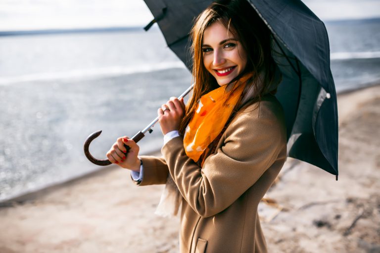 Redhead,Girl,With,Umbrella,By,The,Sea