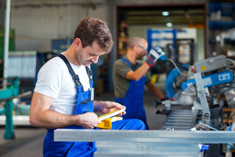 Two,Worker,In,Factory,On,The,Machine