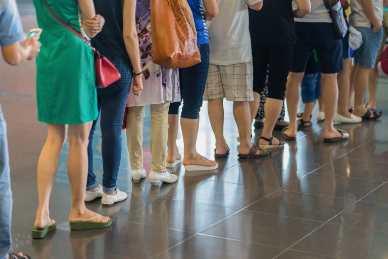 Closeup,Queue,Of,Asian,People,Waiting,At,Boarding,Gate,At