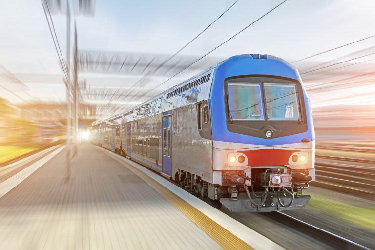 Railroad,Travel,Passenger,Train,With,Motion,Blur,Effect,At,The