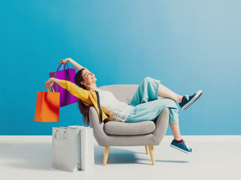 Cheerful,Happy,Shopaholic,Woman,With,Lots,Of,Shopping,Bags,,She