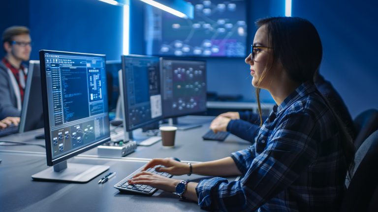 Smart,Young,Female,It,Programer,Working,On,Desktop,Green,Mock-up