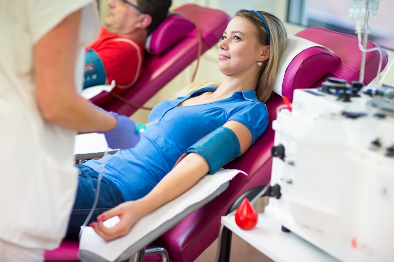 Young,Woman,Giving,Blood,In,A,Modern,Hospital,(color,Toned