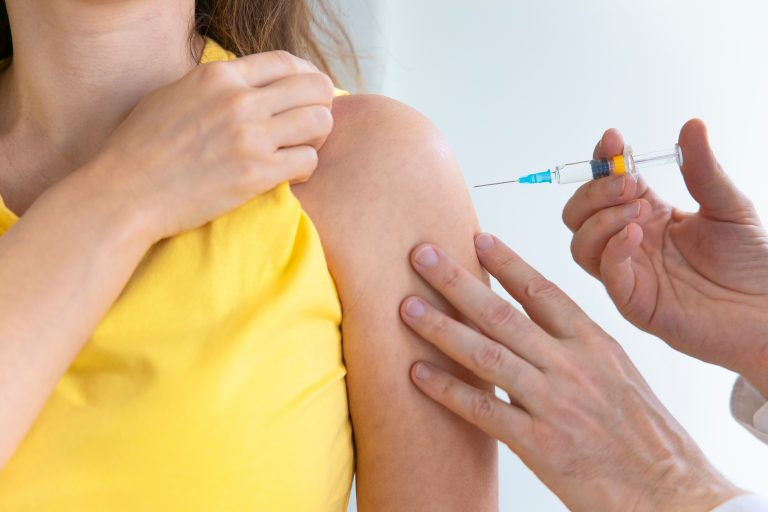 Young,Woman,And,Her,Doctor,Getting,A,Vaccine,In,A