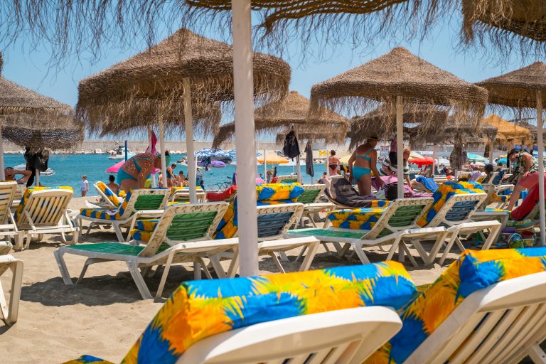 Fuengirola,,Spain,-,June,31,,2018.,People,On,Sunbeds,At