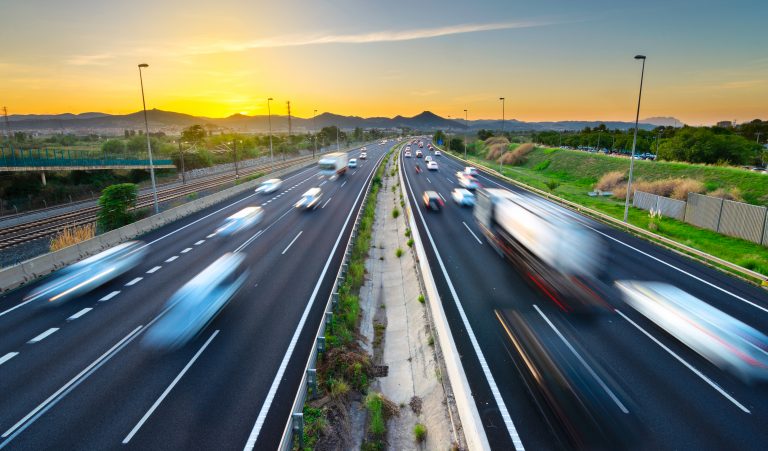 Busy,Highway,At,Sunset,,Vehicles,Coming,And,Going,,City,Stress