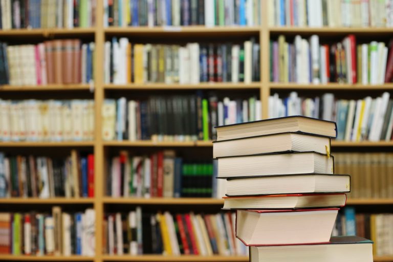 Stack,Of,Books,In,Library
