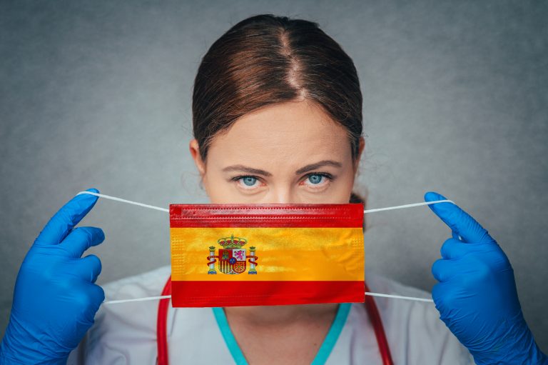 Coronavirus,In,Spain,,Female,Doctor,Portrait,Hold,Protect,Face,Surgical