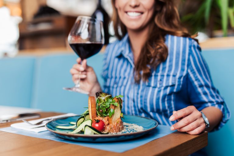 Young,Beautiful,And,Happy,Woman,Enjoying,In,Delicious,Meal,In