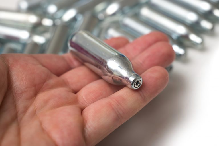 Closeup,Of,Hilarious,Gas,N2o,In,Metallic,Siphon,Cartridge,In