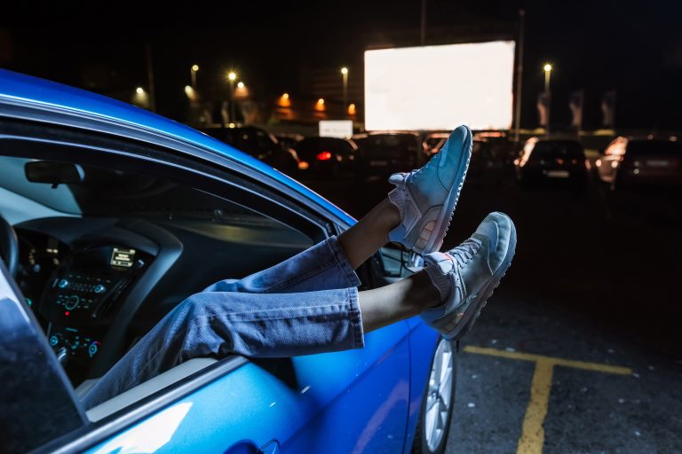 Close,Up,Of,Woman,Hanging,Her,Legs,Out,Of,Car