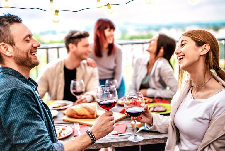 Happy,People,Having,Fun,Drinking,Wine,On,Terrace,At,Private