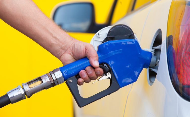Pumping,Gas,At,Gas,Pump.,Closeup,Of,Man,Pumping,Gasoline