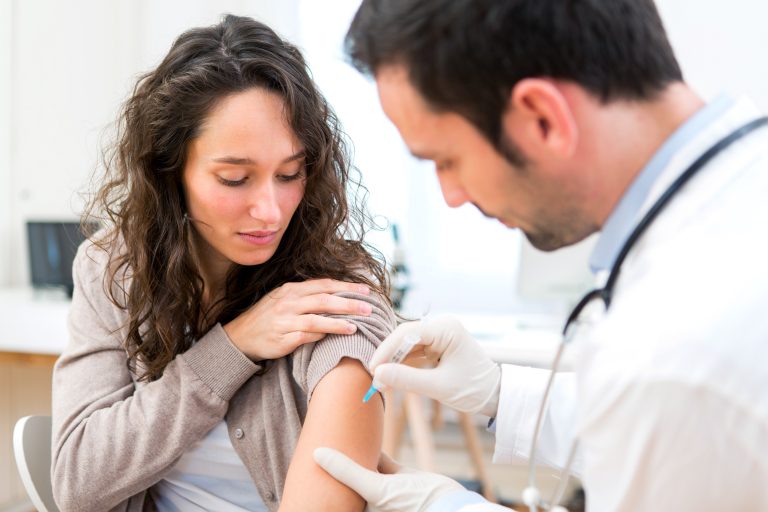 View,Of,A,Young,Attractive,Woman,Being,Vaccinated