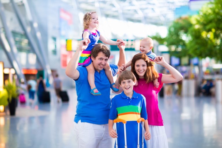 Family,Traveling,With,Kids.,Parents,With,Children,At,International,Airport