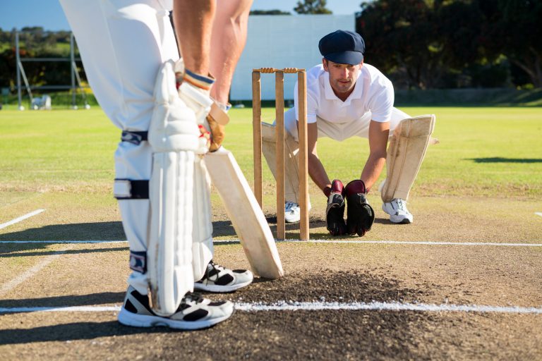 Close,Up,Of,Man,Batting,While,Playying,Cricket,At,Field