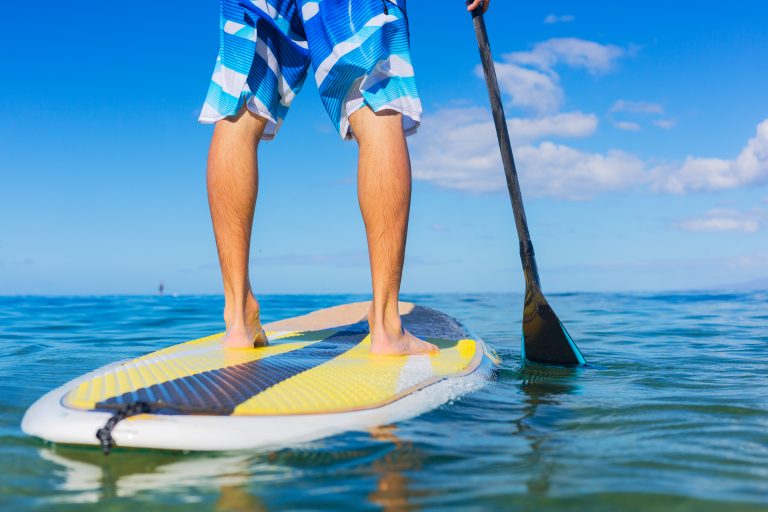Young,Attractive,Mann,On,Stand,Up,Paddle,Board,,Sup,,In