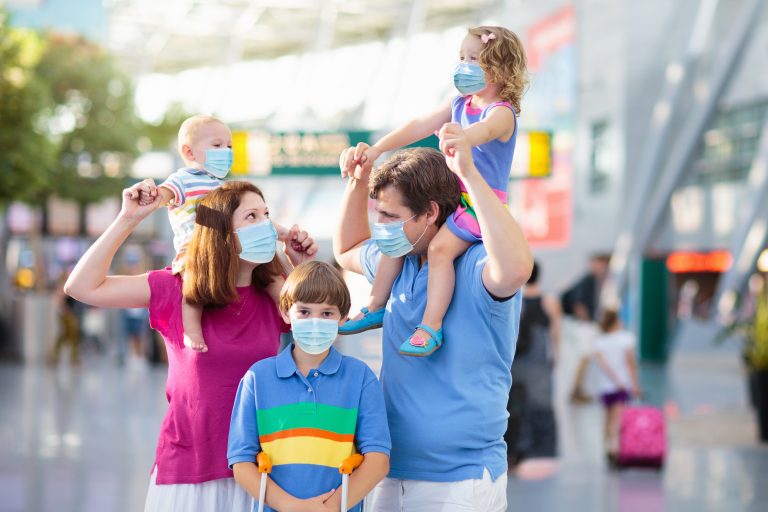 Family,In,Airport,In,Face,Mask.,Virus,Outbreak.,Coronavirus,And