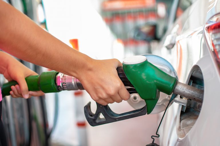 Filling,Up,The,Car,With,Petrol.,Woman's,Hands,Pouring,Gasoline
