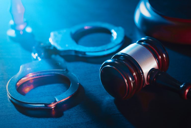 Handcuffs,And,Wooden,Gavel.,Crime,And,Violence,Concept.