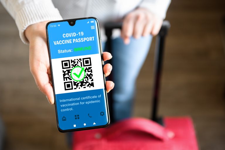 Covid-19,Vaccination,Passport,In,Mobile,Phone,For,Travel,,Tourist,Holds