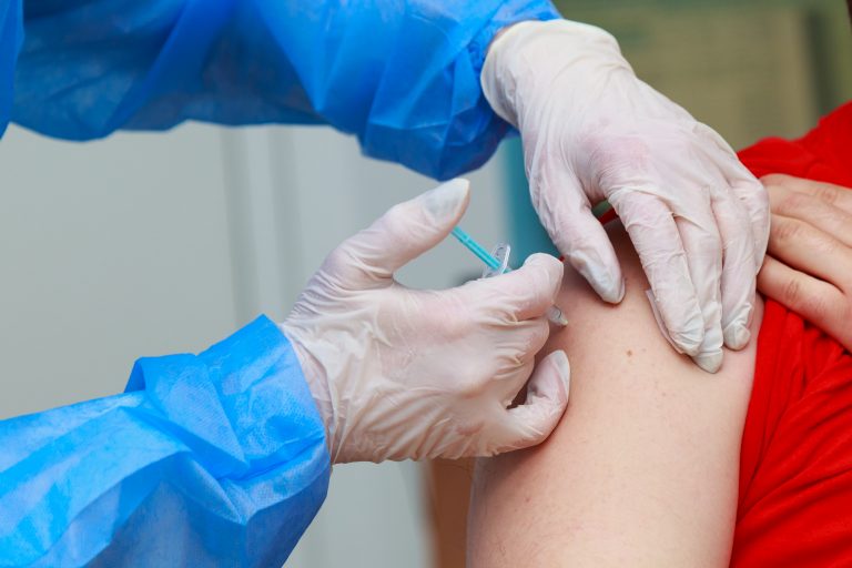 Syringe,Injection,Process,On,Real,Coronavirus,Vaccination.,Fighting,The,Covid-19