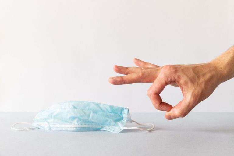 Close,Up,Of,Man,Hand,Gets,Rid,Of,Used,Blue