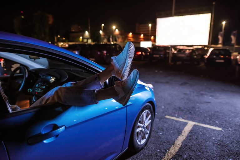 Close,Up,Of,Woman,S,Legs,Dangling,Out,A,Car
