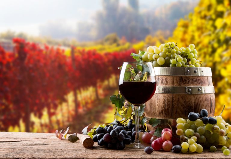 Red,Wine,Bottle,And,Wine,Glass,On,Wooden,Barrel,With