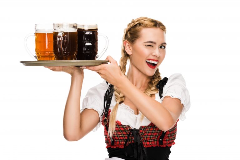 Beautiful,Waitress,In,Traditional,German,Costume,Winking,And,Holding,Beer