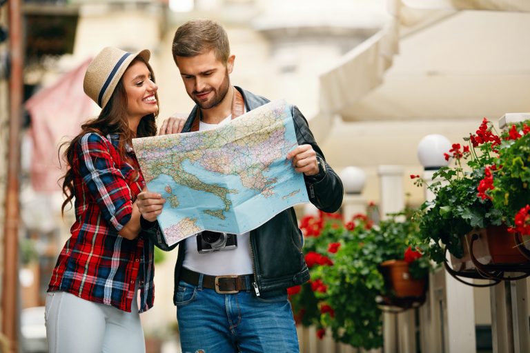 Couple,Using,Map,Traveling,On,Vacations.,Portrait,Of,Beautiful,Happy