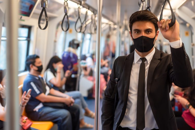 Portrait,Of,Confident,Businessman,In,Black,Suit,Wear,Mask,In