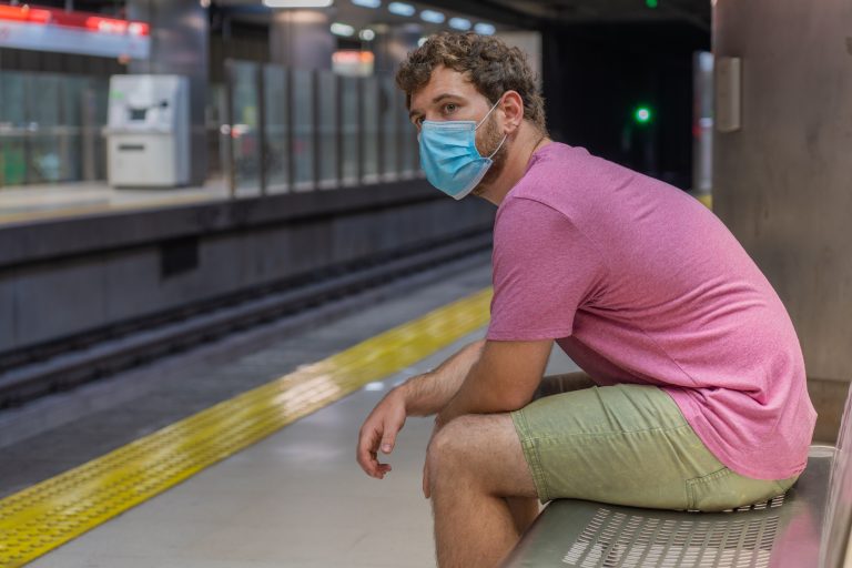 Mallorca,Public,Transport,,Young,Man,Waiting,For,The,Subway,Sitting