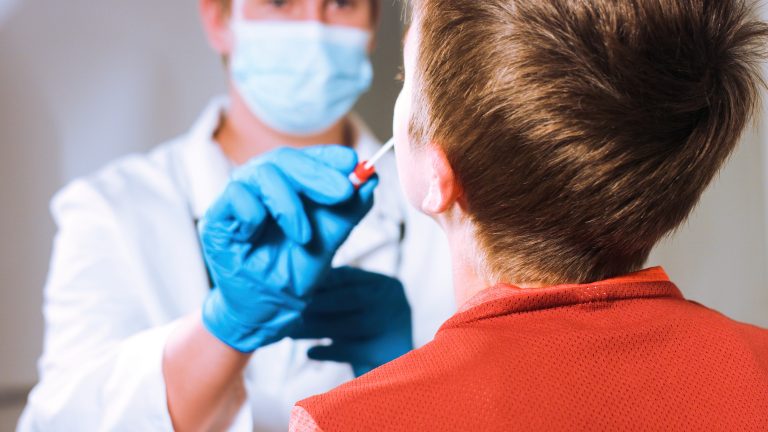 Doctor,Takes,A,Cotton,Swab,Coronavirus,Test,From,Child,Nose