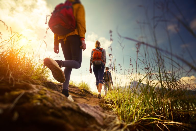 Group,Of,Hikers,Walking,In,Mountains.,Edges,Of,The,Image