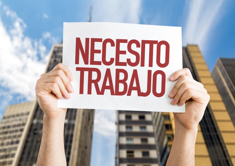 Need,A,Job,(in,Spanish),Placard,With,Urban,Background
