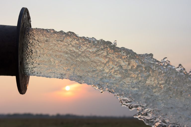 Water,Flow,From,Pipe,,,Sunset,And,Abstract
