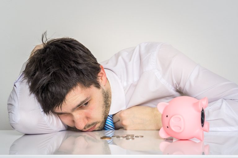Young,Worried,Man,Has,Empty,Piggy,Money,Bank.