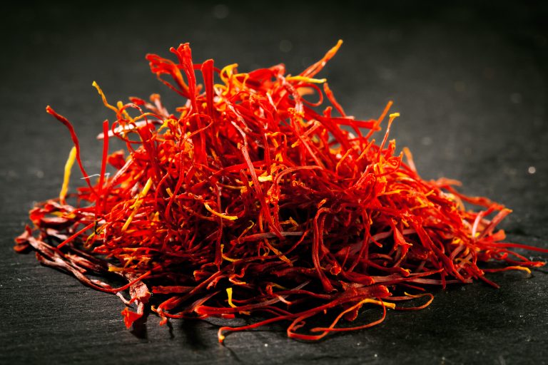 Heap,Of,Saffron,Threads,On,Dark,Iron,Cast,Background