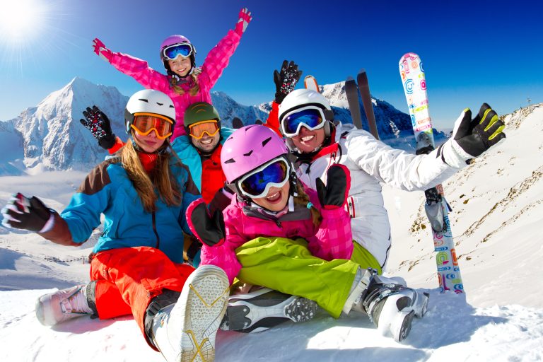Skiing,,Winter,,Snow,,Sun,And,Fun,-,Family,Enjoying,Winter