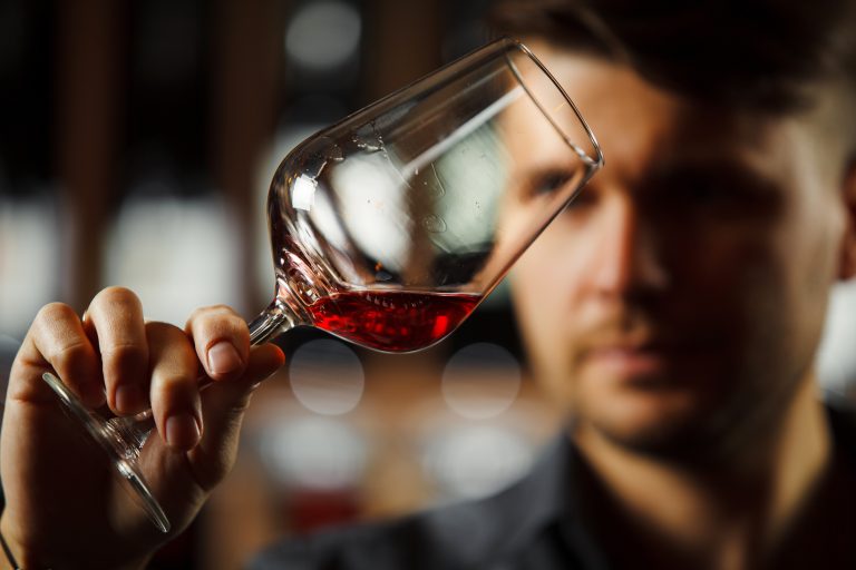 Bokal,Of,Red,Wine,On,Background,,Male,Sommelier,Appreciating,Drink