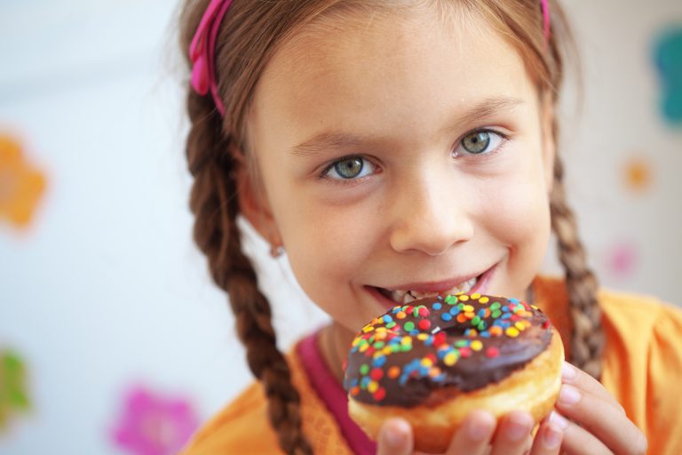 Cute,Kid,Girl,Eating,Sweet,Donuts