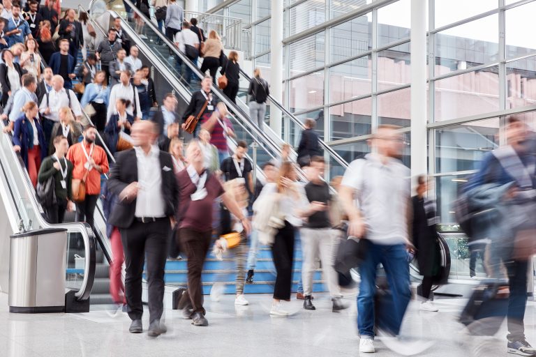 Many,People,And,People,On,Escalator,At,A,Business,Trade