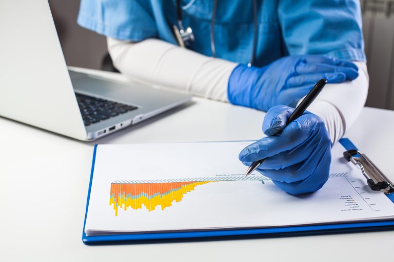 Doctor,Wearing,Protective,Gloves,Analyzing,Covid-19,Info,Data,coronavirus,Global,Pandemic