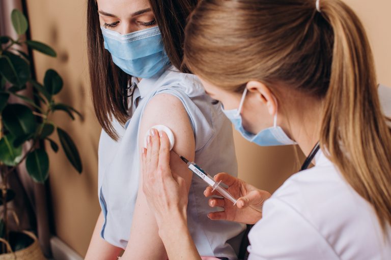 Close-up,Woman,Doctor,Holds,A,Syringe,And,And,Makes,An