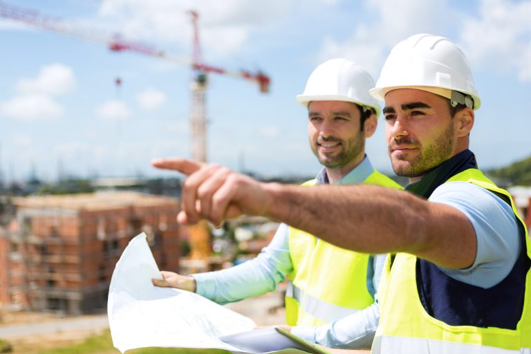 View,Of,A,Worker,And,Architect,Watching,Some,Details,On