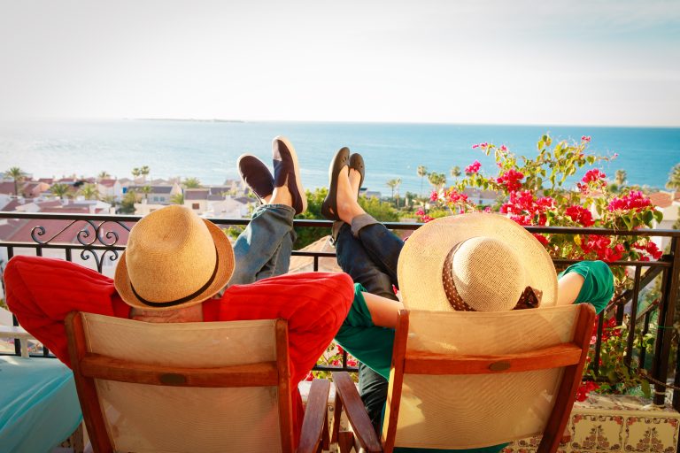 Happy,Couple,Relax,On,Balcony,Terrace