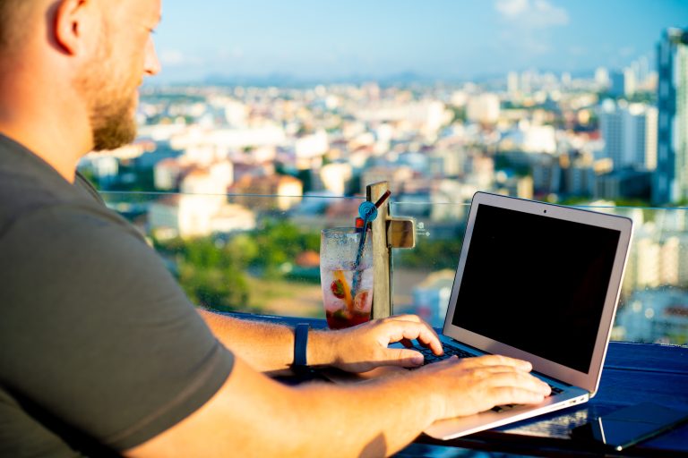 Man,Working,On,A,Computer,In,A,Cafe,With,A
